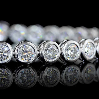 LabGrownDiamonds.com 7 carat total weight round bezel lab-grown diamond tennis bracelet in white gold with 36 round diamonds.
