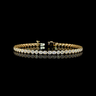 Lab Grown Diamonds 3 CTW round bezel tennis bracelet with 51 lab-grown diamonds on a 7-inch yellow gold chain.