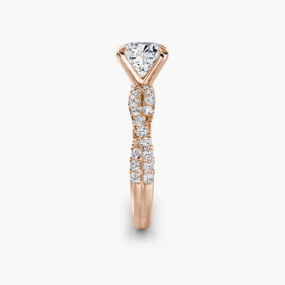 Twisted pavé engagement ring setting in rose gold showing the twisted band profile, with a cushion-cut lab grown center diamond. || #metal_rose gold #diamond shape_cushion