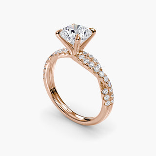Twisted pavé engagement ring setting in rose gold with a cushion-cut lab grown center diamond and twisted pavé diamond band, three-quarter view. || #metal_rose gold #diamond shape_cushion