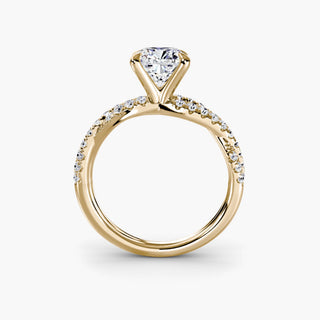 Twisted pavé engagement ring setting in yellow gold, side profile view showing the twisted pavé band with a cushion-cut lab grown center diamond. || #metal_yellow gold #diamond shape_cushion