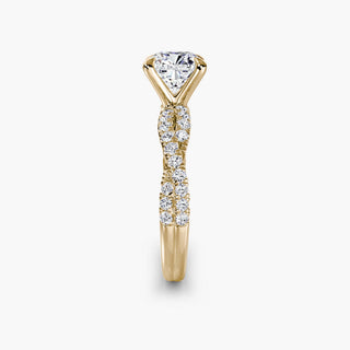 Twisted pavé engagement ring setting in yellow gold showing the twisted band profile, with a cushion-cut lab grown center diamond. || #metal_yellow gold #diamond shape_cushion