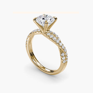 Twisted pavé engagement ring setting in yellow gold with a cushion-cut lab grown center diamond and twisted pavé diamond band, three-quarter view. || #metal_yellow gold #diamond shape_cushion