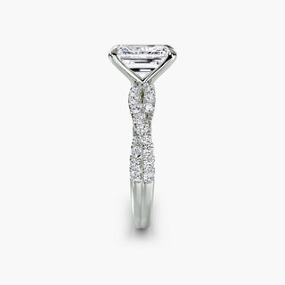 Twisted pavé engagement ring setting in white gold showing the twisted band profile, with an emerald-cut lab grown center diamond. || #metal_white gold|platinum #diamond shape_emerald