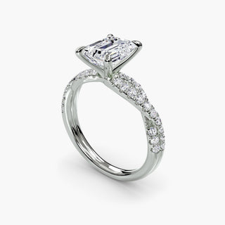 Twisted pavé engagement ring setting in white gold with an emerald-cut lab grown center diamond and twisted pavé diamond band, three-quarter view. || #metal_white gold|platinum #diamond shape_emerald
