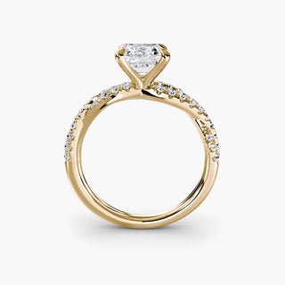 Twisted pavé engagement ring setting in yellow gold, side profile view showing the twisted pavé band with an emerald-cut lab grown center diamond. || #metal_yellow gold #diamond shape_emerald