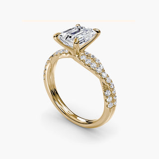 Twisted pavé engagement ring setting in yellow gold with an emerald-cut lab grown center diamond and twisted pavé diamond band, three-quarter view. || #metal_yellow gold #diamond shape_emerald