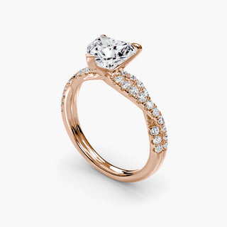 Twisted pavé engagement ring setting in rose gold with a heart-shaped lab grown center diamond and twisted pavé diamond band, three-quarter view. || #metal_rose gold #diamond shape_heart