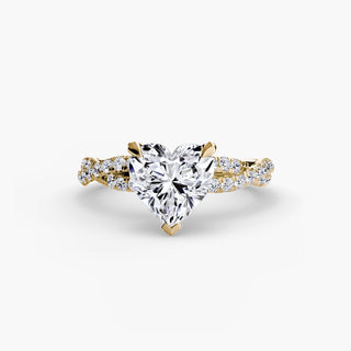 Twisted pavé engagement ring setting in yellow gold, featuring a heart-shaped lab grown center diamond with a twisted pavé diamond band. || #metal_yellow gold #diamond shape_heart