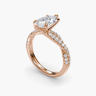 Twisted pavé engagement ring setting in rose gold with a marquise-cut lab grown center diamond and twisted pavé diamond band, three-quarter view. || #metal_rose gold #diamond shape_marquise