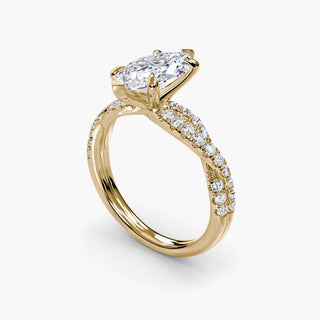 Twisted pavé engagement ring setting in yellow gold with a marquise-cut lab grown center diamond and twisted pavé diamond band, three-quarter view. || #metal_yellow gold #diamond shape_marquise