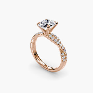 Twisted pavé engagement ring setting in rose gold with an oval-cut lab grown center diamond and twisted pavé diamond band, three-quarter view. || #metal_rose gold #diamond shape_oval