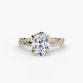 Twisted pavé engagement ring setting in yellow gold, featuring an oval-cut lab grown center diamond with a twisted pavé diamond band. || #metal_yellow gold #diamond shape_oval