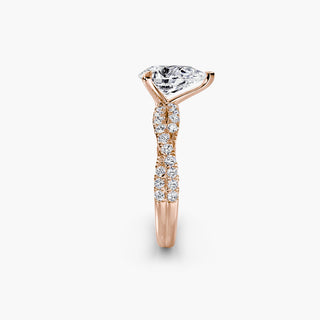 Twisted pavé engagement ring setting in rose gold showing the twisted band profile, with a pear-shaped lab grown center diamond. || #metal_rose gold #diamond shape_pear