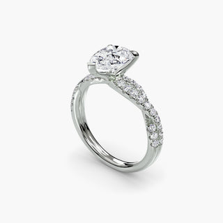 Twisted pavé engagement ring setting in white gold with a pear-shaped lab grown center diamond and twisted pavé diamond band, three-quarter view. || #metal_white gold|platinum #diamond shape_pear