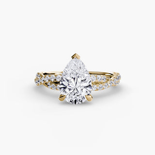 Twisted pavé engagement ring setting in yellow gold, featuring a pear-shaped lab grown center diamond with a twisted pavé diamond band. || #metal_yellow gold #diamond shape_pear