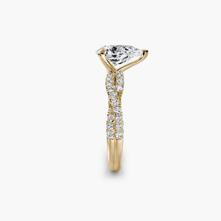 Twisted pavé engagement ring setting in yellow gold showing the twisted band profile, with a pear-shaped lab grown center diamond. || #metal_yellow gold #diamond shape_pear