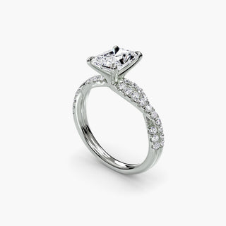 Twisted pavé engagement ring setting in white gold with a radiant-cut lab grown center diamond and twisted pavé diamond band, three-quarter view. || #metal_white gold|platinum #diamond shape_radiant
