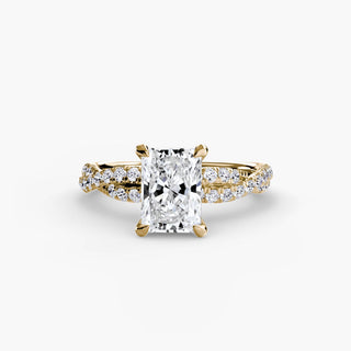 Twisted pavé engagement ring setting in yellow gold, featuring a radiant-cut lab grown center diamond with a twisted pavé diamond band. || #metal_yellow gold #diamond shape_radiant
