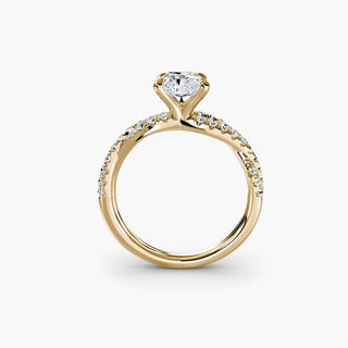 Twisted pavé engagement ring setting in yellow gold, side profile view showing the twisted pavé band with a radiant-cut lab grown center diamond. || #metal_yellow gold #diamond shape_radiant