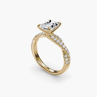 Twisted pavé engagement ring setting in yellow gold with a radiant-cut lab grown center diamond and twisted pavé diamond band, three-quarter view. || #metal_yellow gold #diamond shape_radiant