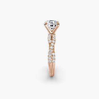 Twisted pavé engagement ring setting in rose gold showing the twisted band profile, with a round lab grown center diamond. || #metal_rose gold #diamond shape_round