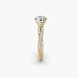 Twisted pavé engagement ring setting in yellow gold showing the twisted band profile, with a round lab grown center diamond. || #metal_yellow gold #diamond shape_round