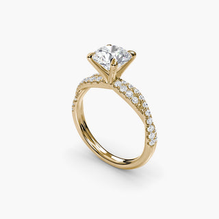 Twisted pavé engagement ring setting in yellow gold with a round lab grown center diamond and twisted pavé diamond band, three-quarter view. || #metal_yellow gold #diamond shape_round
