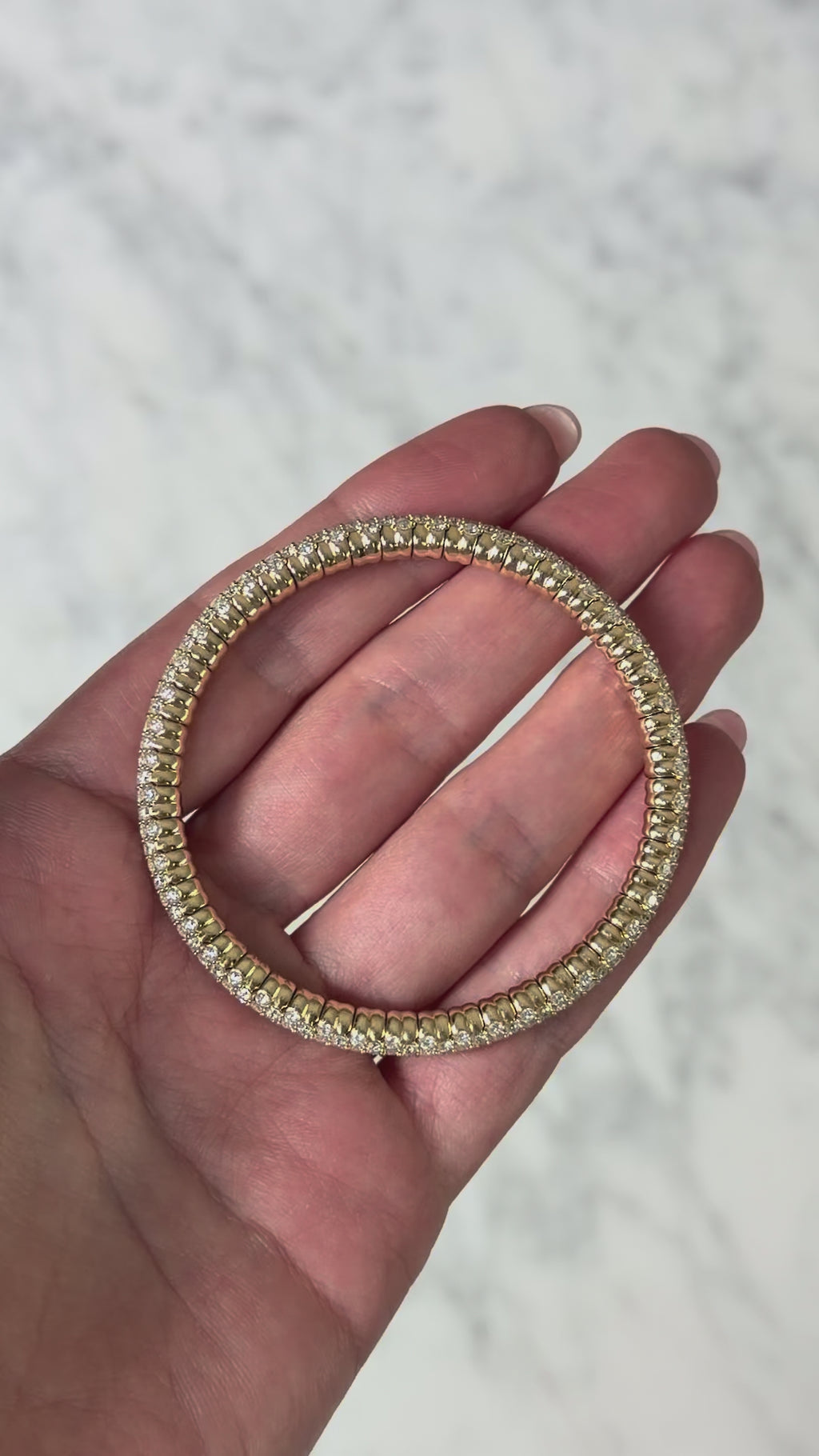 Video of lab grown diamond stretch bangle bracelet, showing different angles and the stretch mechanism.