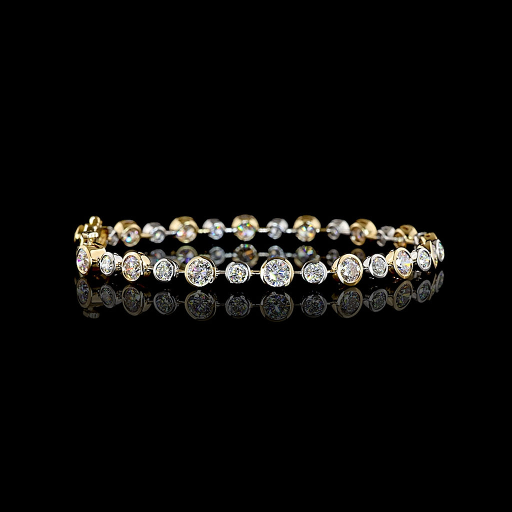Round lab grown diamond station bracelet with alternating size round diamonds in a two tone 14k white and yellow gold bezel setting, 5.5 carats total. || #total carat weight_5.5
