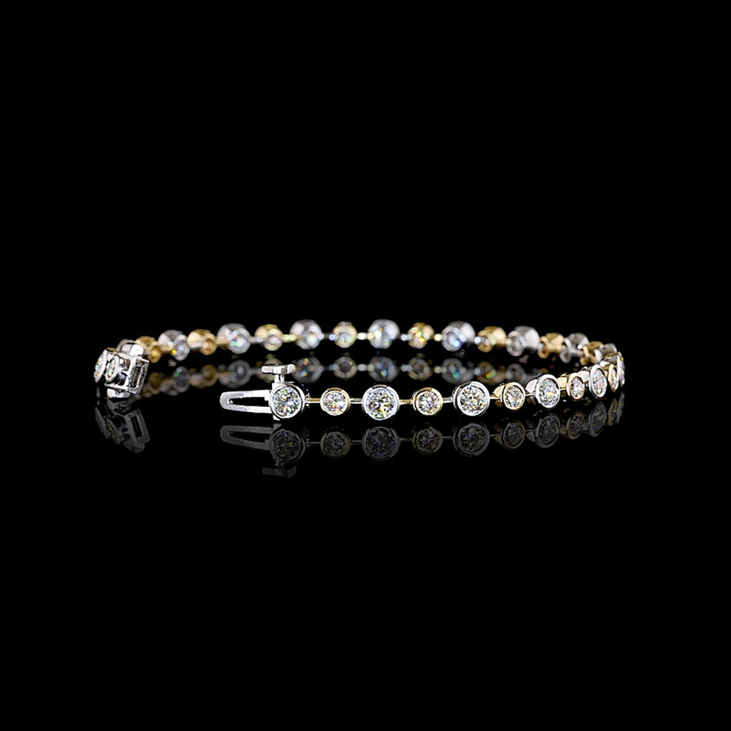 Round lab grown diamond station bracelet with alternating size round diamonds in a two tone 14k white and yellow gold bezel setting, 3 carats total. || #total carat weight_3