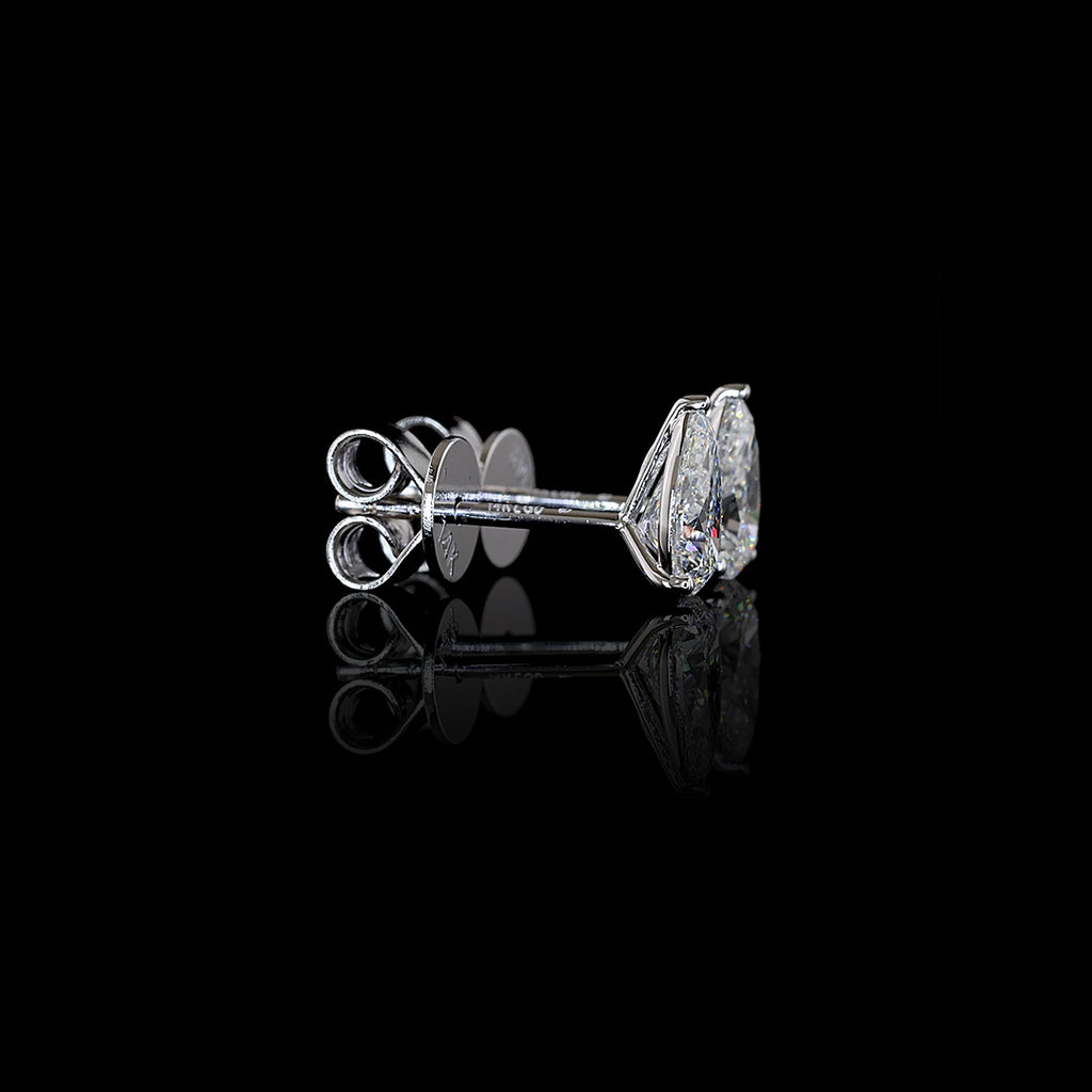 Video of 0.50 carat Pear-shaped lab grown diamond stud earrings in 14k white gold, martini setting, 1 carat total pear studs.