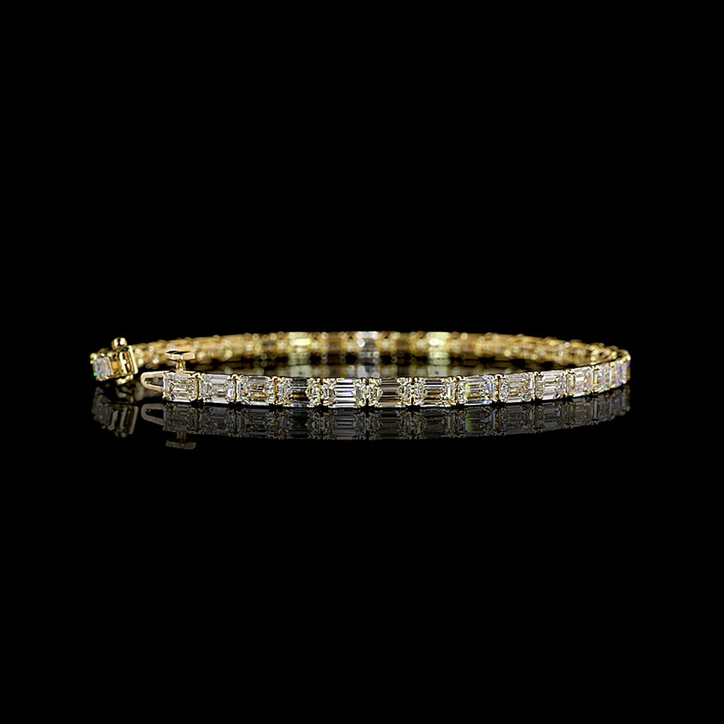 Video of East-West Emerald-cut lab grown diamond tennis bracelet in 14k yellow gold, prong setting, 10 carats total.