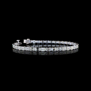 Video of East-West Emerald-cut lab grown diamond tennis bracelet in 14k white gold, prong setting, 10 carats total.