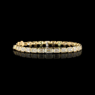 Video of East-West Emerald-cut lab grown diamond tennis bracelet in 14k yellow gold, bezel setting, 10 carat total weight.