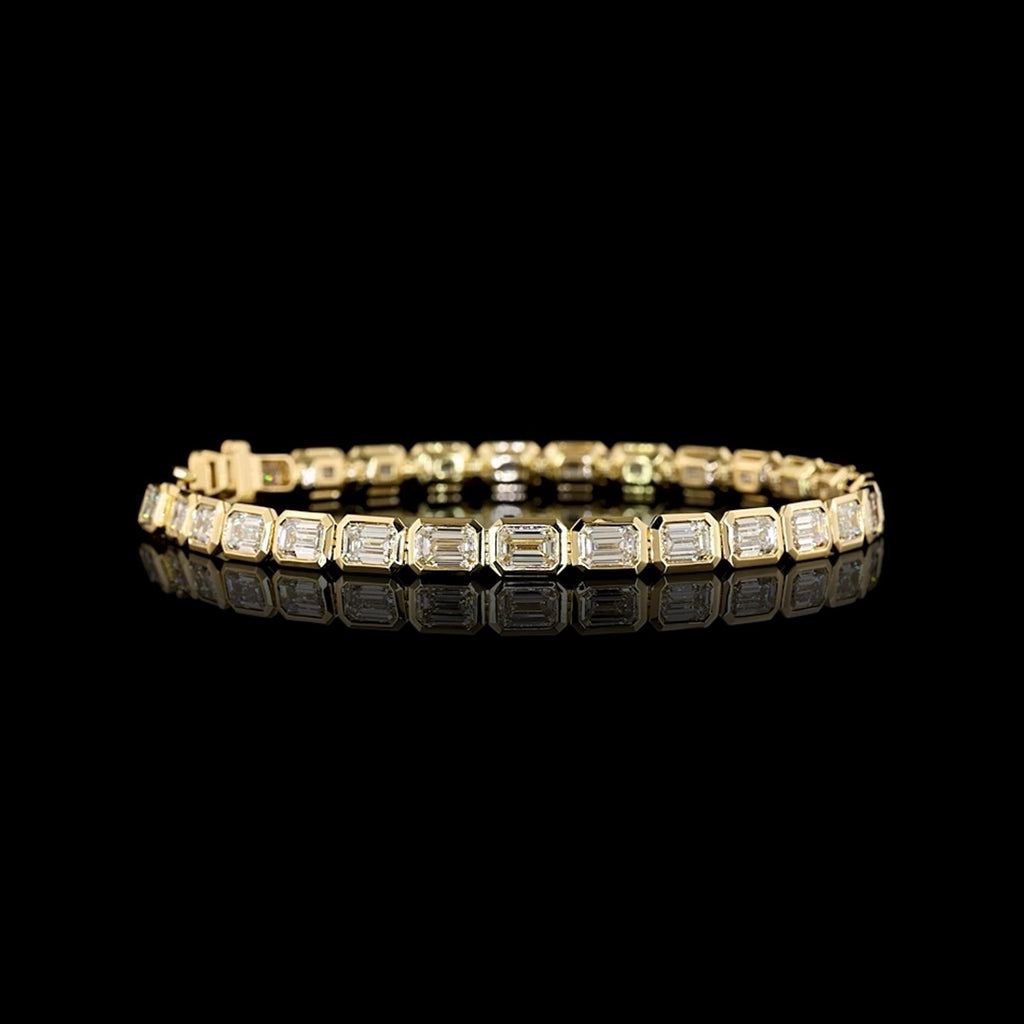 Video of East-West Emerald-cut lab grown diamond tennis bracelet in 14k yellow gold, bezel setting, 10 carat total weight.