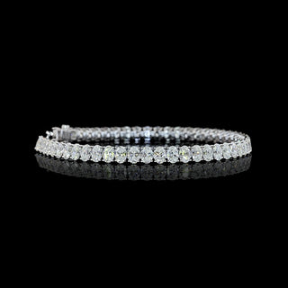Video of Oval lab grown diamond tennis bracelet with 25-pointer diamonds in a 14k white gold prong setting, 12 carats total. 