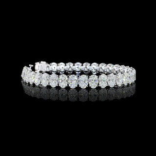 Video of Oval lab grown diamond tennis bracelet with 75-pointer oval diamonds in 14k white gold prong setting, 25 carats total.