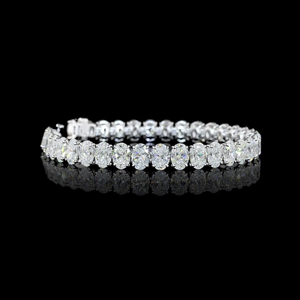 Video of Oval lab grown diamond tennis bracelet with 75-pointer oval diamonds in 14k white gold prong setting, 25 carats total.