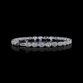 Video of East-West oval lab grown diamond tennis bracelet, 50-pointer (half carat each) diamonds in a claw prong setting, 12 carats total. 
