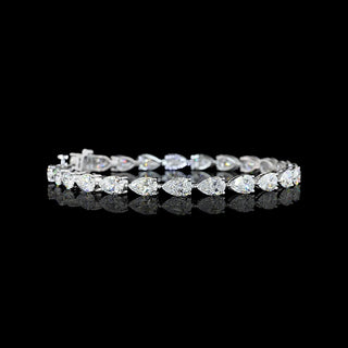 Video of East-West Pear-shaped lab grown diamond tennis bracelet in 14k white gold, with half carat each (50-pointer) diamonds in a prong setting, 12 carats total.