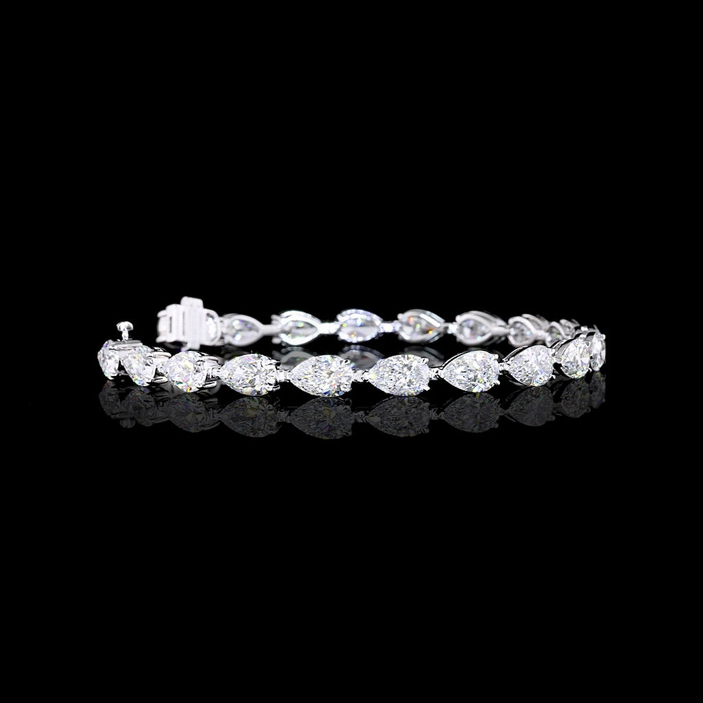 Video of east-west pear shaped lab grown diamond tennis bracelet in 14k white gold, with 70-pointer pear diamonds in a prong setting, 14 carats total.